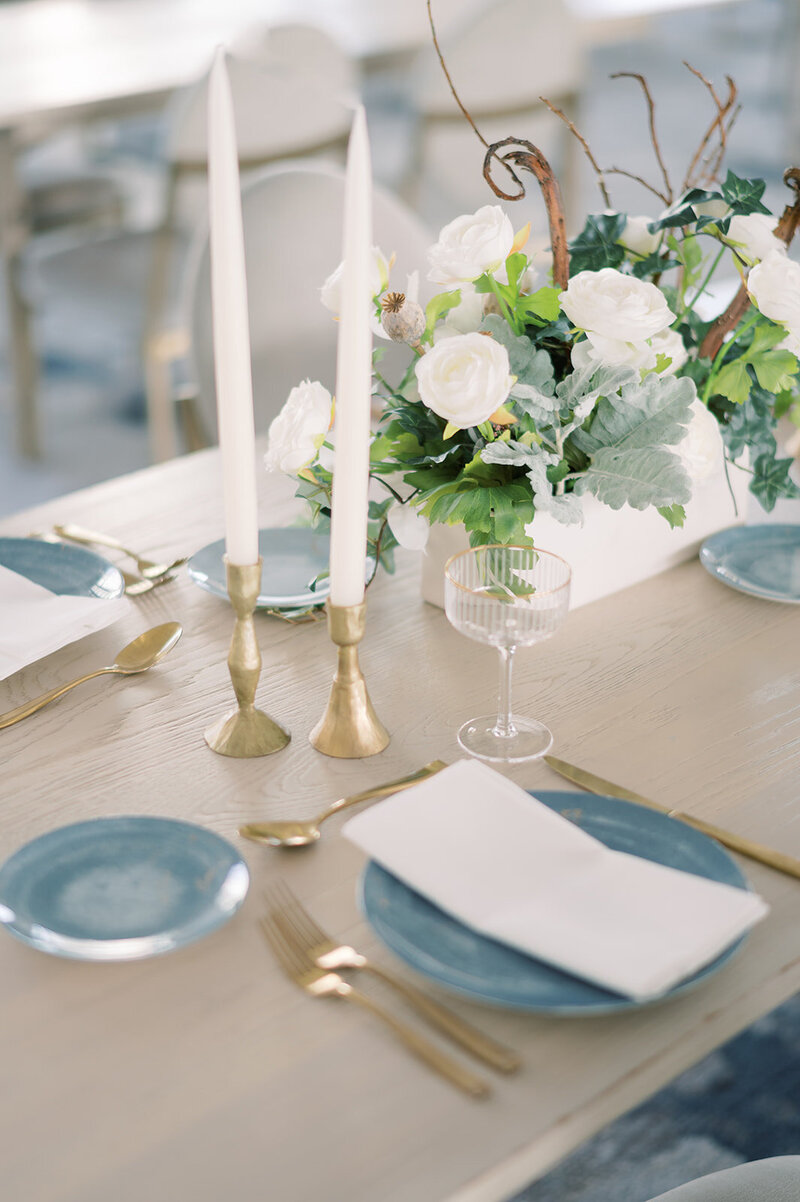 A blue and gold themed table setting prepared by a corporate event planner and designer in Hamilton Ontario