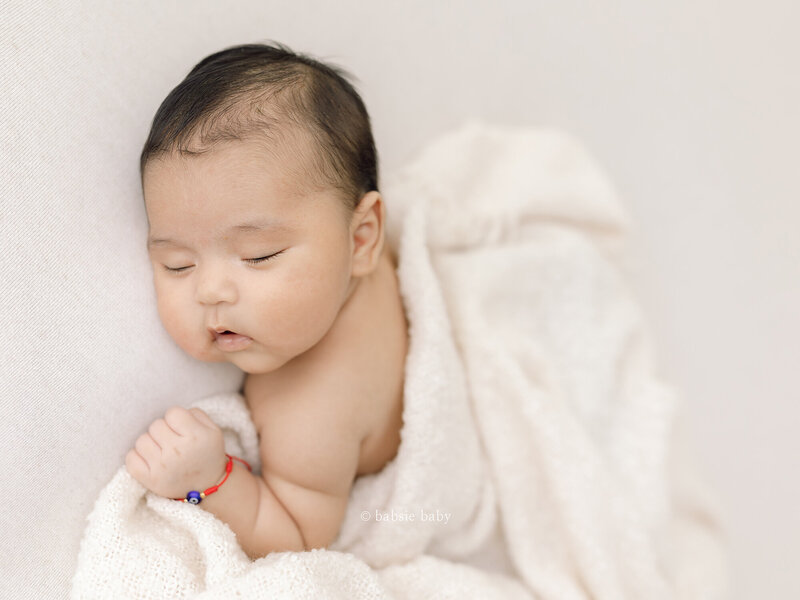 A baby girl photo at her newborn session at Babsie's San Diego North County studio.
