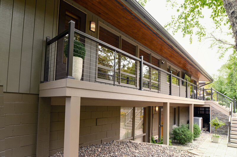 Catwalk of TimberTech Advanced PVC deck with two-step fascia and coordinating post wraps. 