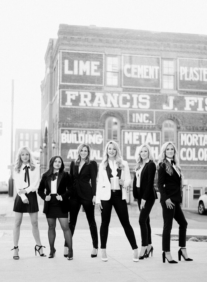 Bello & Blue team wearing suits and heels in Denver Colorado