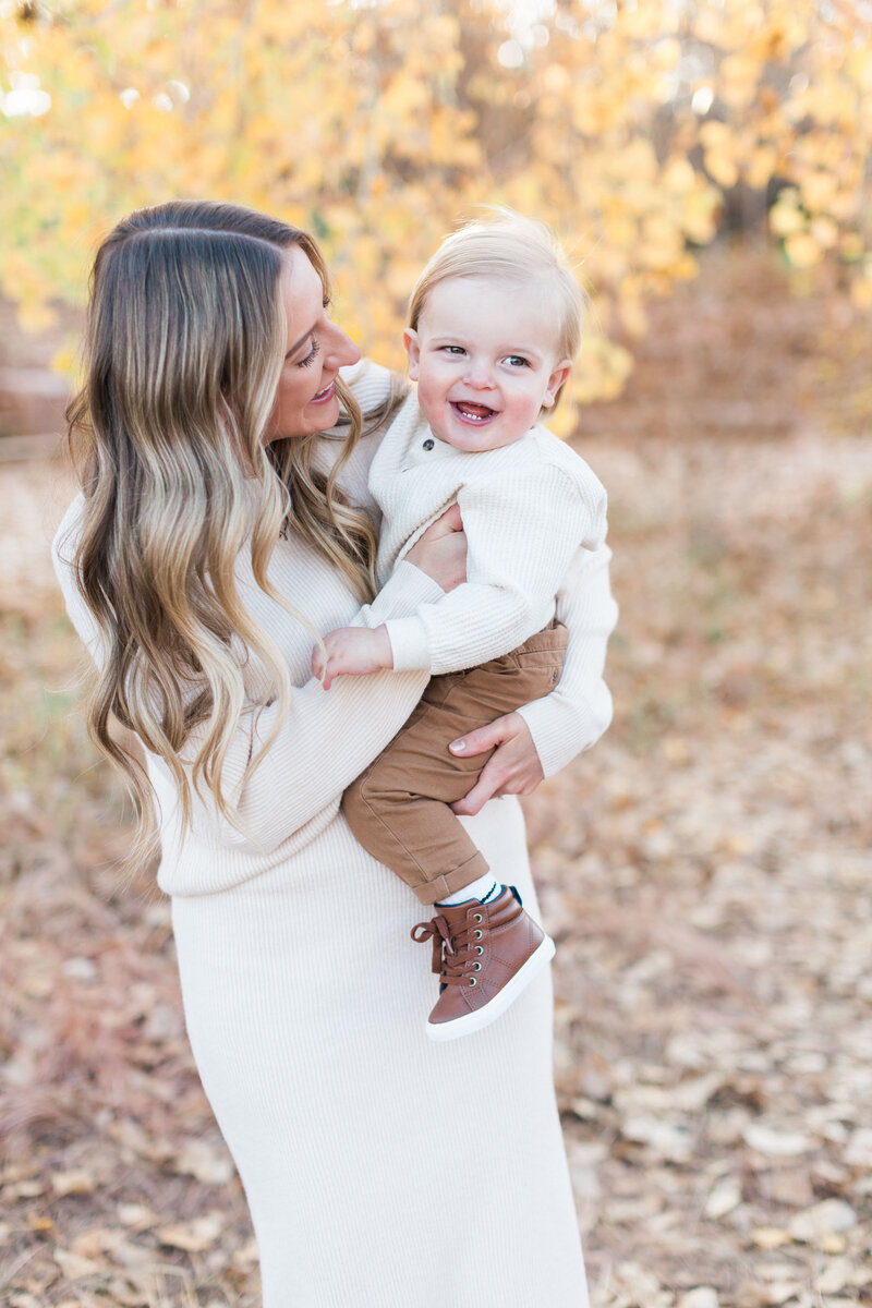Mom and her toddler during their fall family session in Denver, Colorado