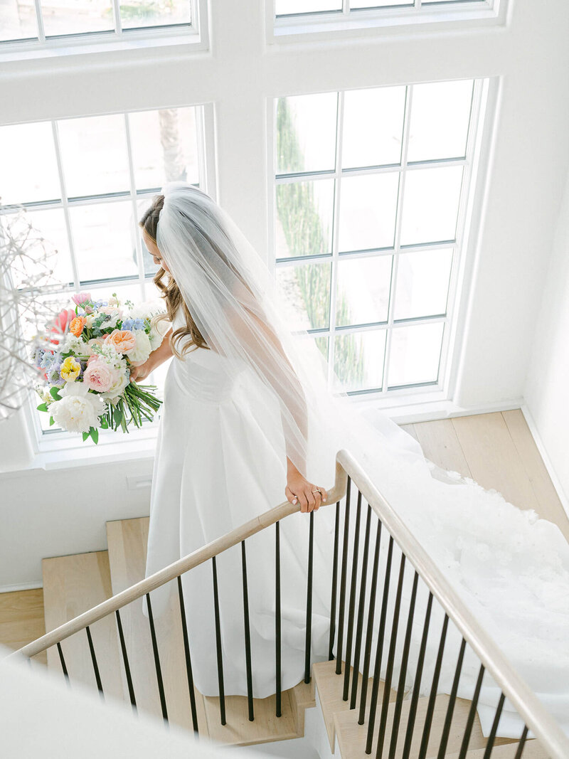 bride walking down stairs ready for Alys Beach wedding