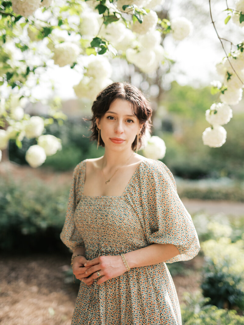 Huntsville photographer in floral dress at the huntsville botanical garden