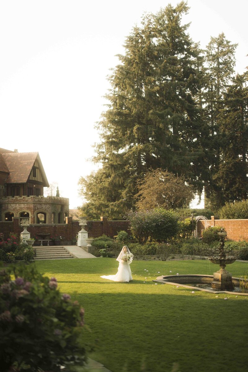 Bride walking through the garden to the wedding ceremony