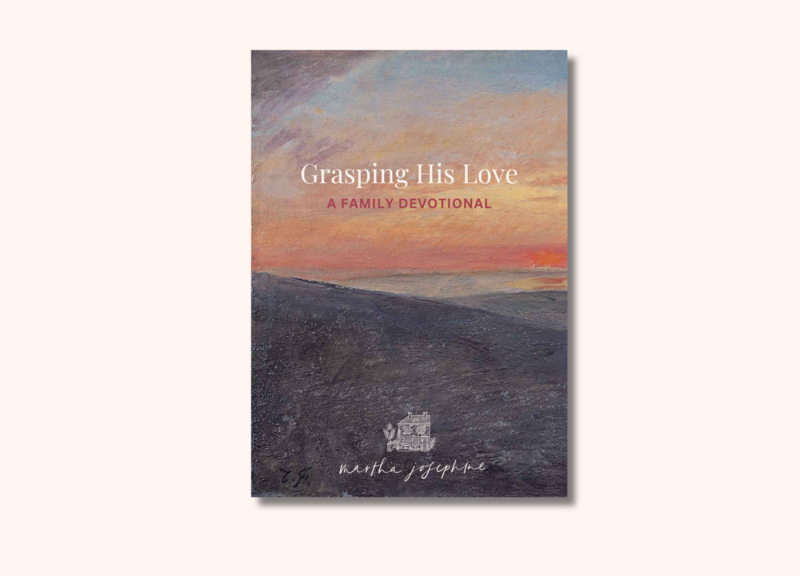 Front cover reads Grasping His Love A Family Devotional by Martha Josephine, with an image of a pink and orange sunrise in the desert