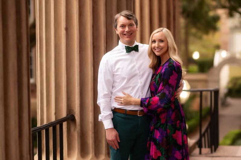 Couple embraces during Family Photos in Charleston.