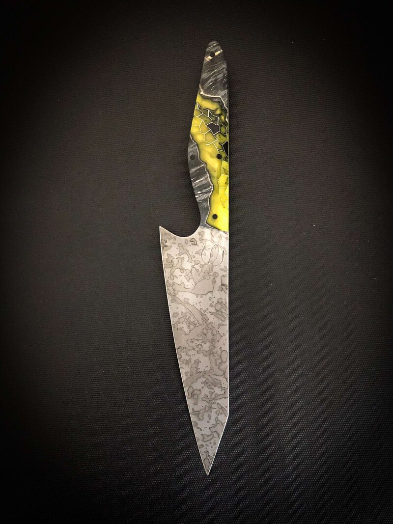 Knife with patterned blade with yellow and black honeycomb design handle