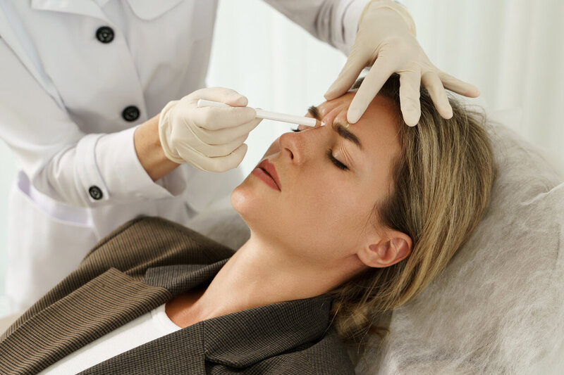 Client receiving Botox injection for wrinkle reduction at Gloss RVA Med Spa