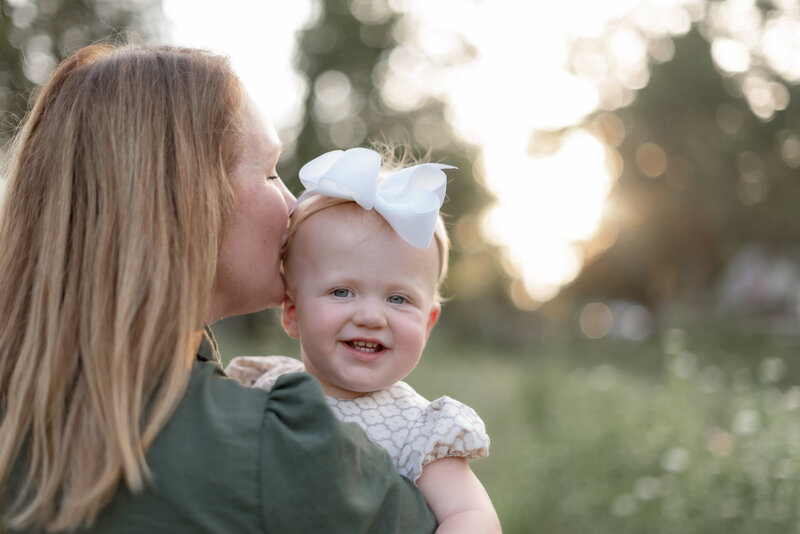 family photographer outside with camera for behind the scenes shot