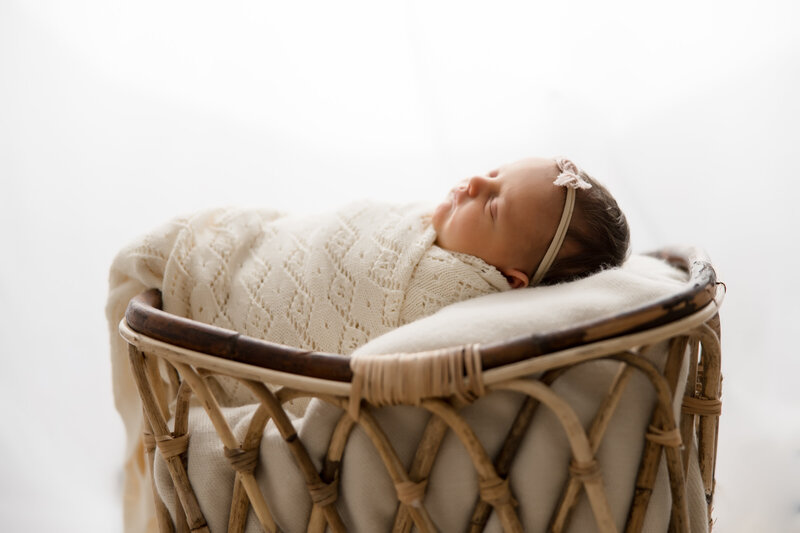 Indianapolis newborn photography - sleeping newborn girl on white