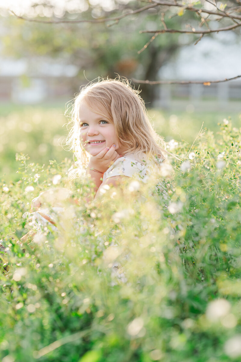 little girl in flowers during family photos