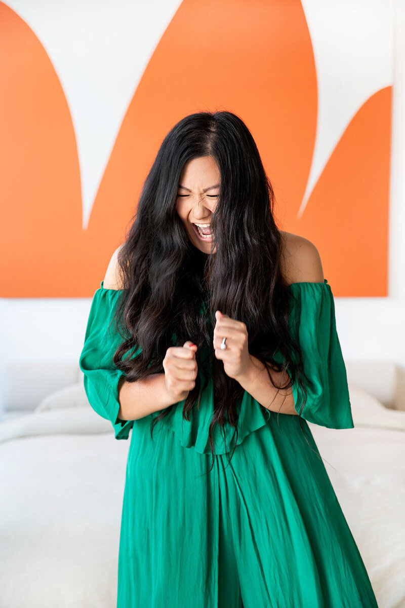 anita-bed-orangeart-looking-down-standing-excited