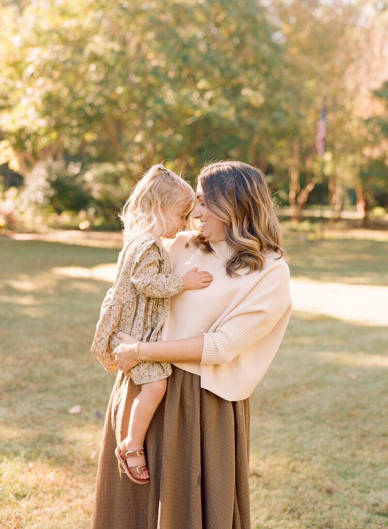 Toddler and mom snuggling during a Raleigh family photography session. Image by Raleigh family, maternity & newborn photographer A.J. Dunlap Photography.