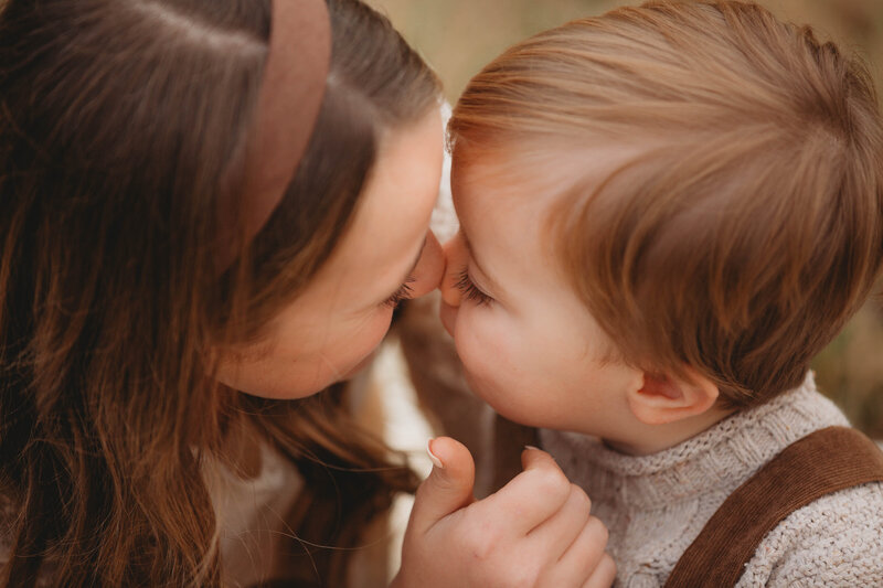 A boy and girl touch noses and embrace at a park in Blacksburg, Virginia. 