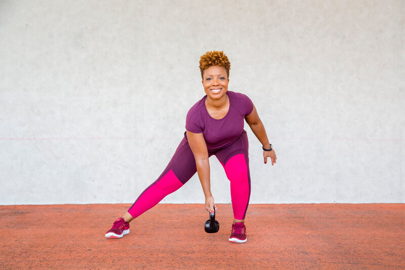 Michelle doing a work out with a weight