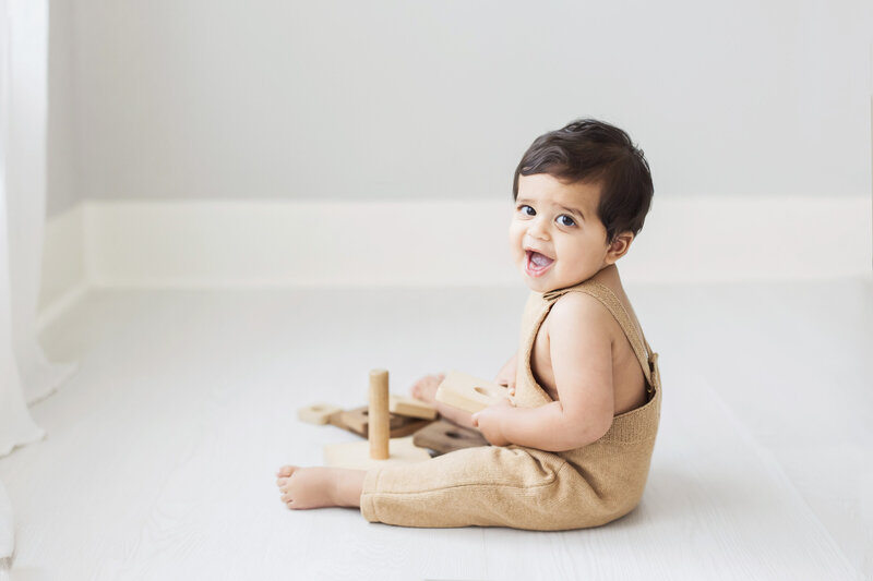 baby crawling on white floor