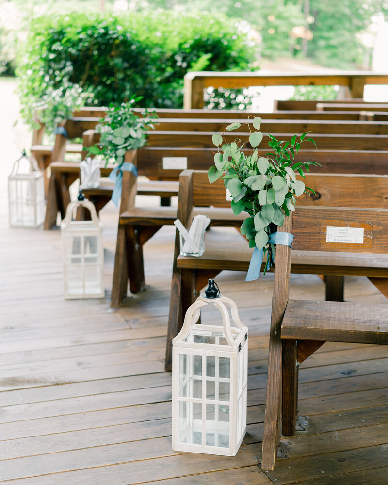 white carriage laterns lining the ceremony aisle at koury farms wedding