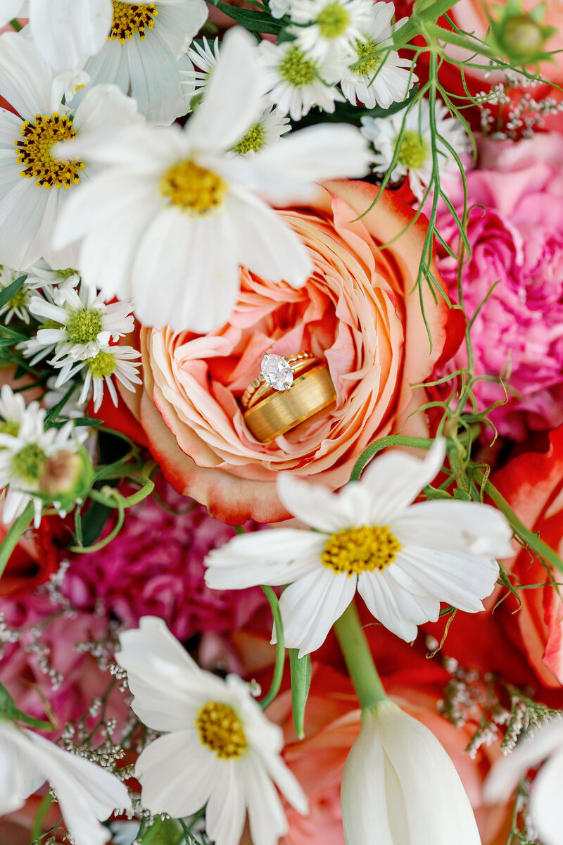 colorful and stunning photo of an engagement ring and wedding band
