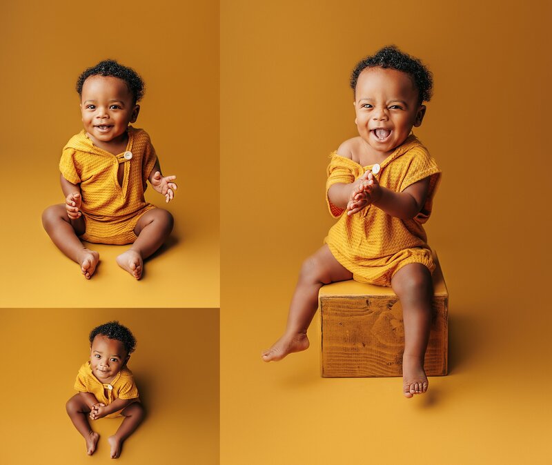 Smiling baby sitting on neutral studio backdrop