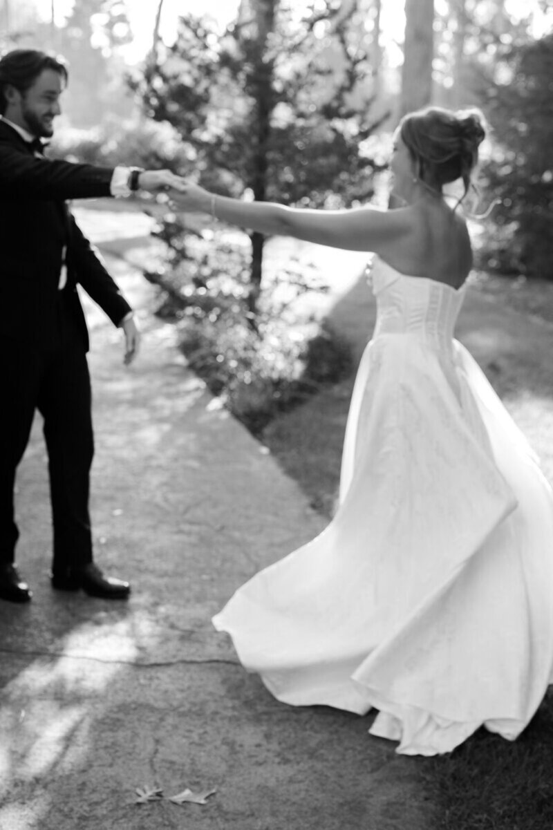 Cincinnati wedding photography of bride and groom holding hands dancing.