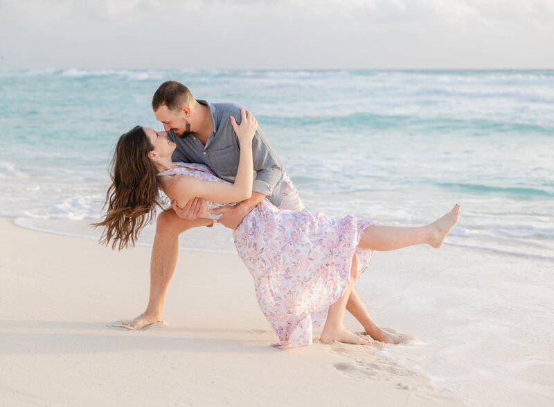 Couple on beach dip