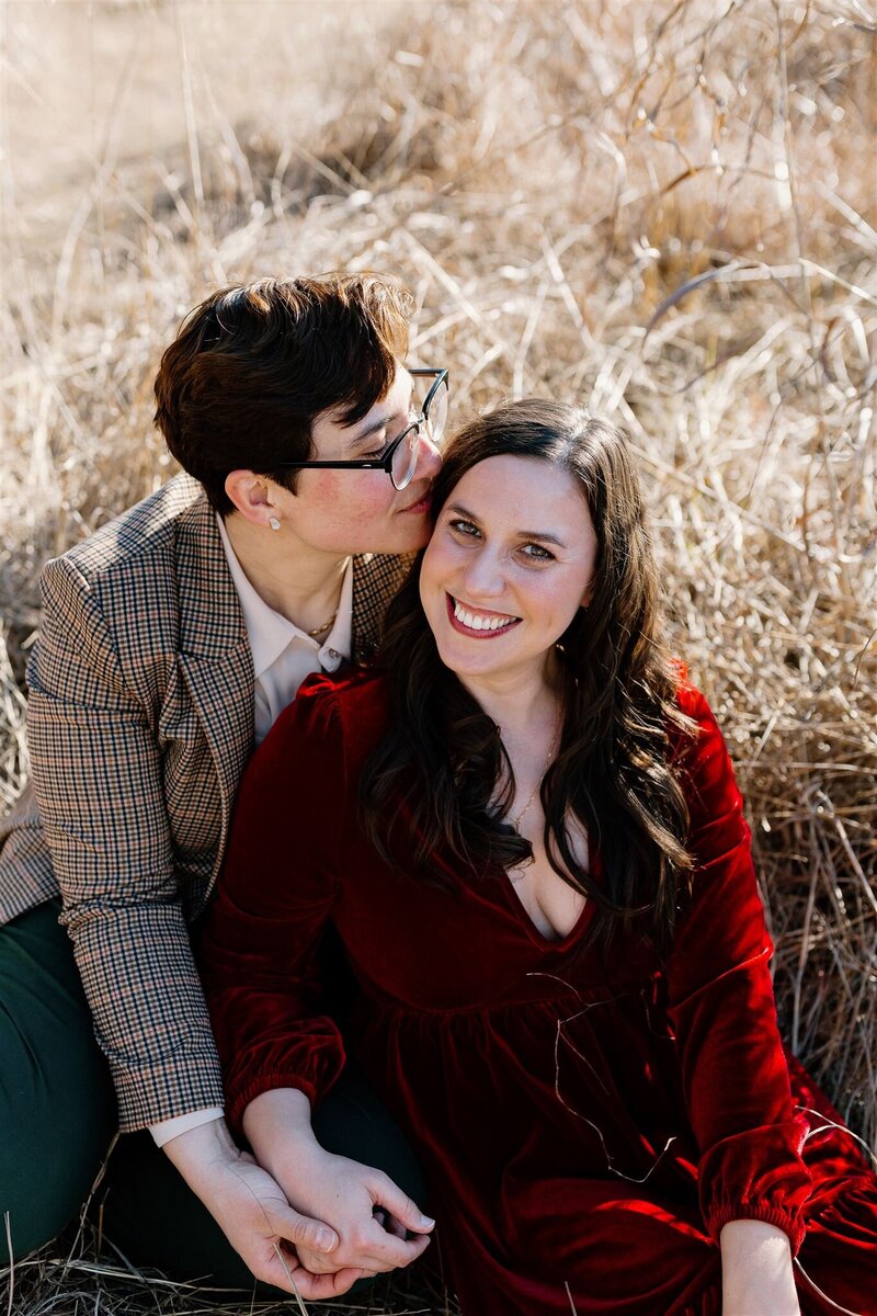 lesbian couple smiling at each other
