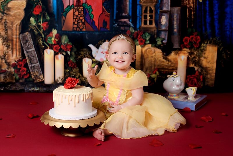 1 year old girl Beauty & The Beast theme cake smash by Vancouver Cake Smash Photographer Amber Theresa Photography.