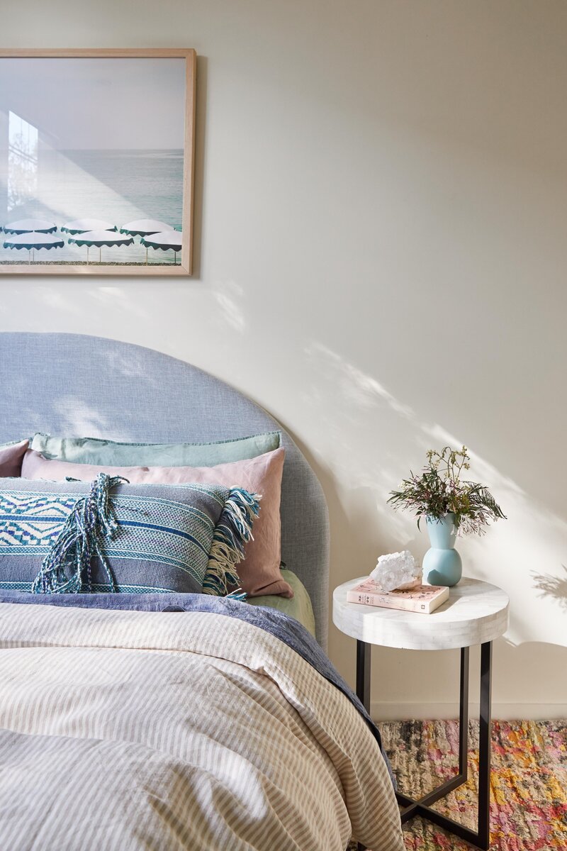 Bedroom styled with mid-century details by Melbourne interior decorator service.