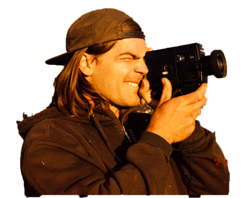 man holding a super 8 camera