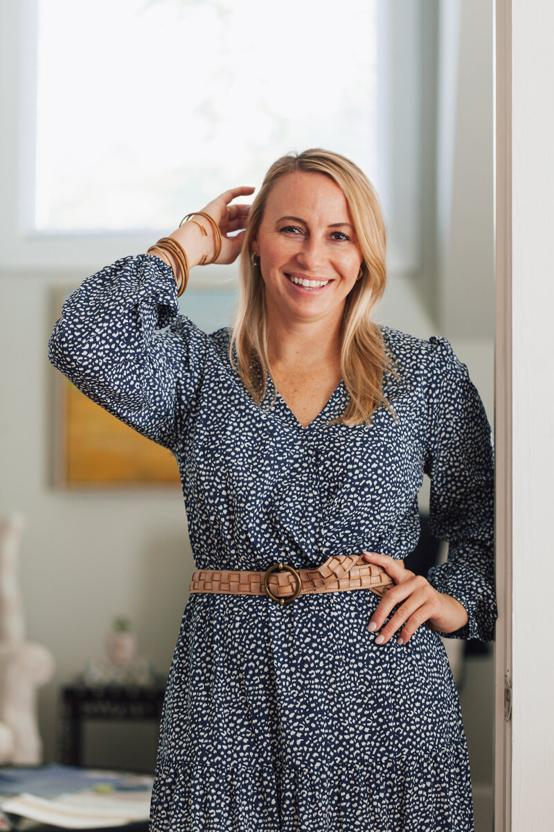 interior-designer-lifestyle-portrait-standing-in-office-doorframe-for-brand-session-dilworth-charlotte