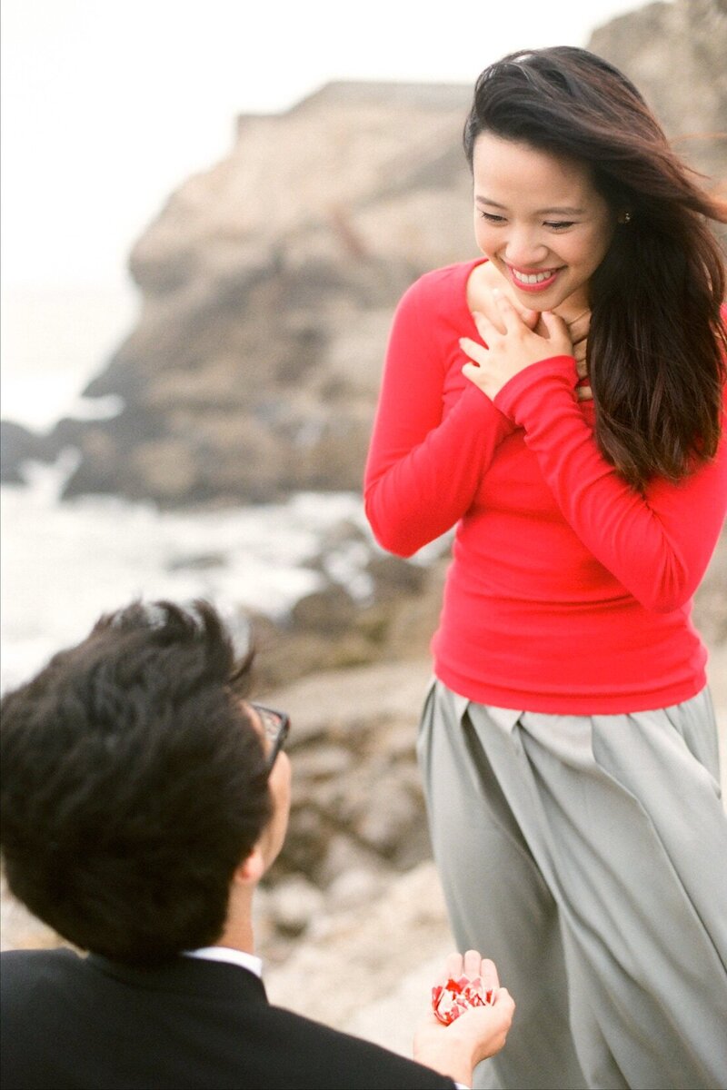 Surprise proposal at Sutro Baths man on his knees