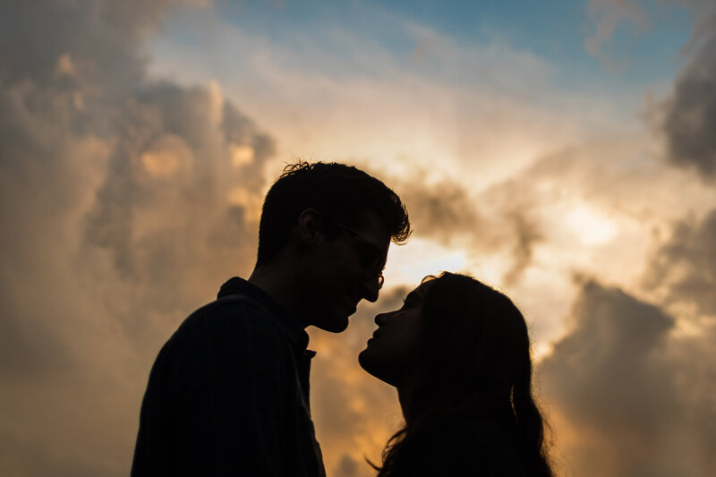 Couple looking at each other during sunset