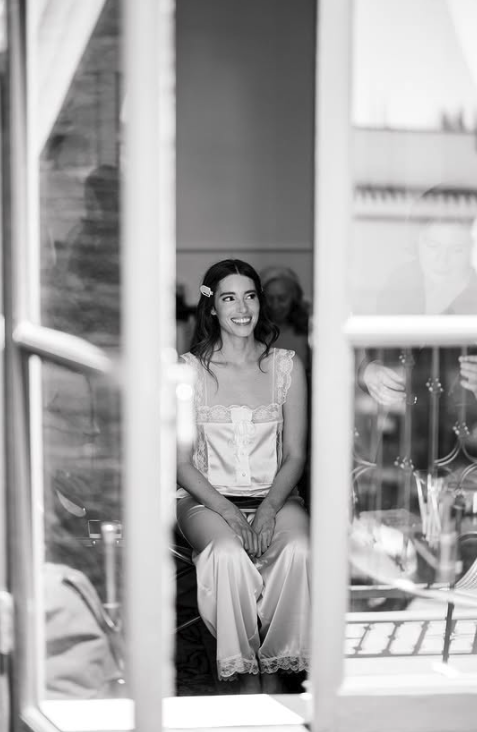 Calm, intimate moment between makeup artist and client during prep