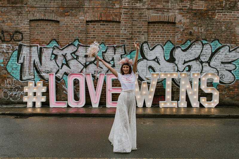 bride with arms up