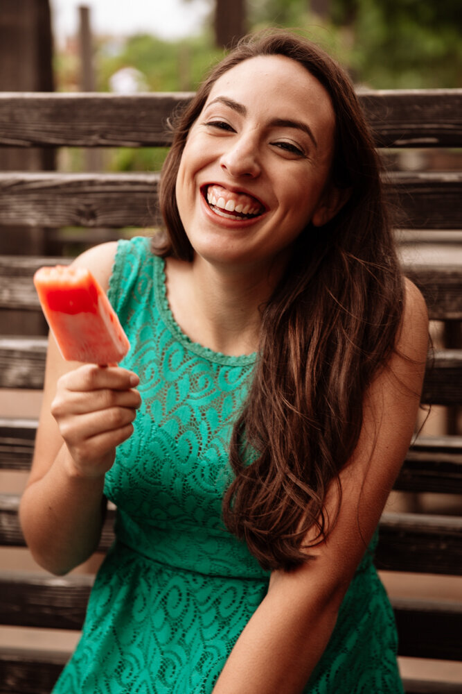 Girl Eating Popsicle and laughing