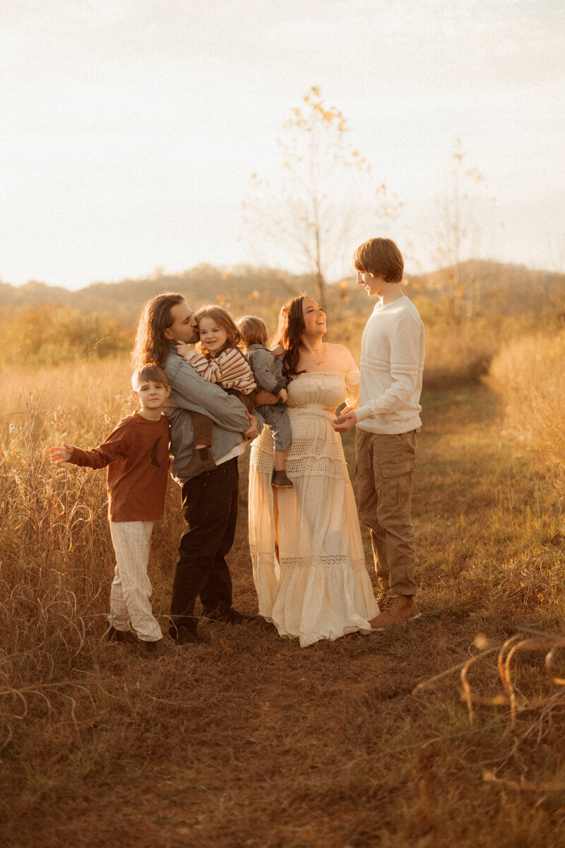 family in a field of golden hour in nashville tennessee