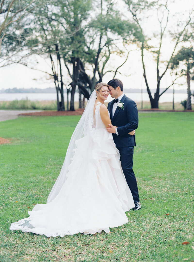 Bride and groom portrait on the front lawn of Lowndes Grove. Charleston film photographer