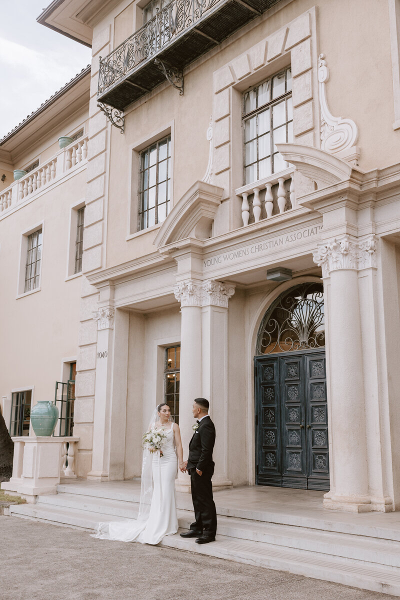 cafe julia european architecture with wedding couple standing in front