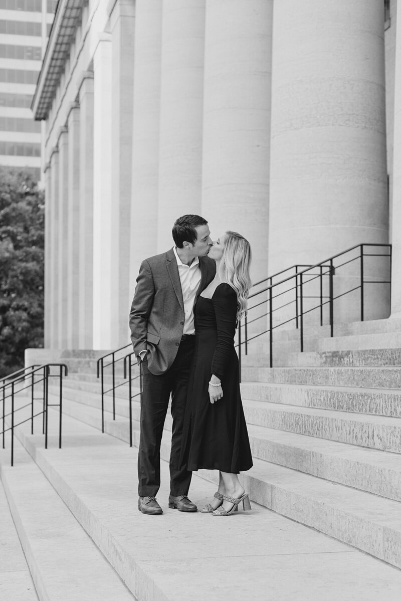 couple kissing at the ohio state house taken by cincinnati ohio wedding photographer ashleigh grzybowski