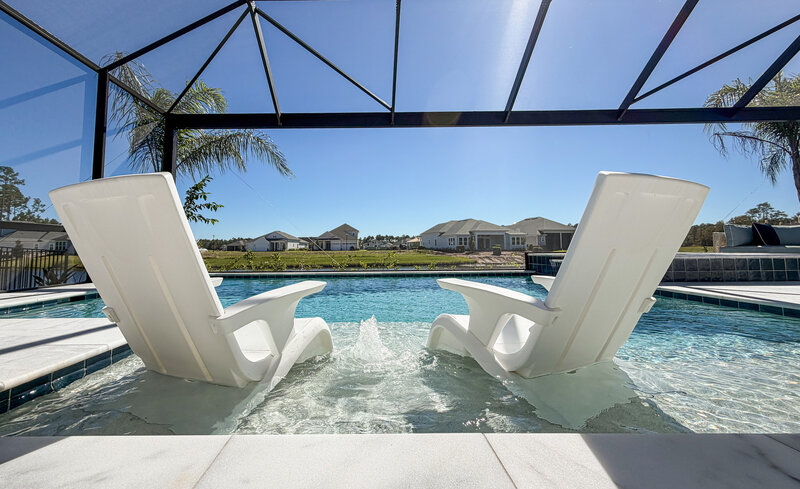 Custom backyard in Jacksonville with pool and spa by Southern Outdoor Spaces