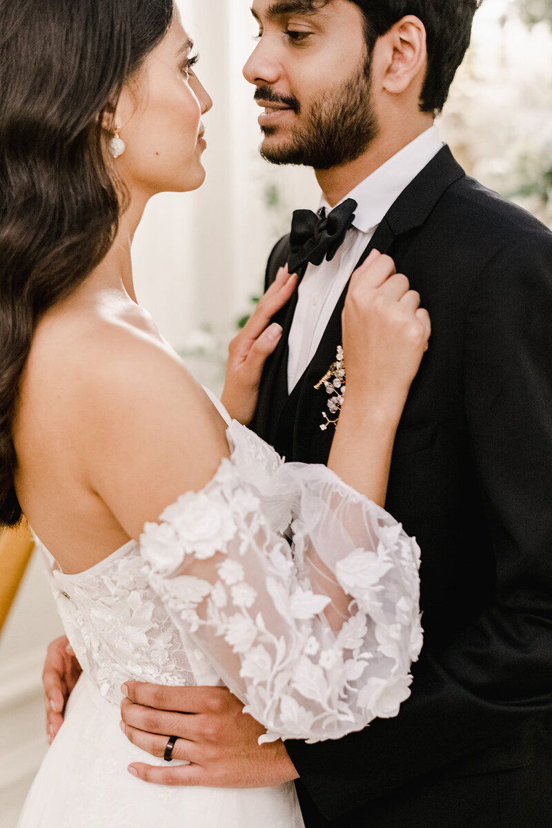 close up of bride and groom embracing