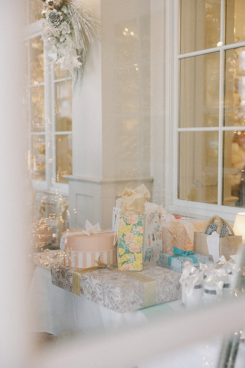 a pile of gifts at a party
