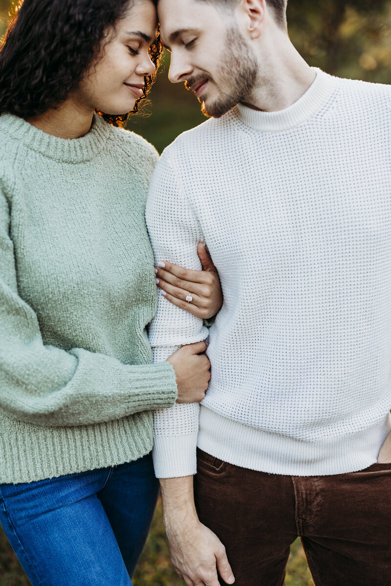 Louisville wedding photographer captures cozy fall engagement at Waterfront Park in Kentucky.