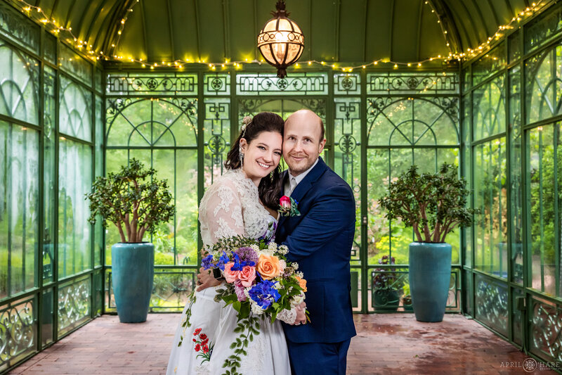 Wedding Photography of a couple on their wedding day at the Woodland Mosaic greenhouse at Denver Botanic Gardens