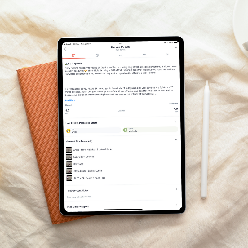 a tablet with a StrideHer half marathon run and strength plan displayed