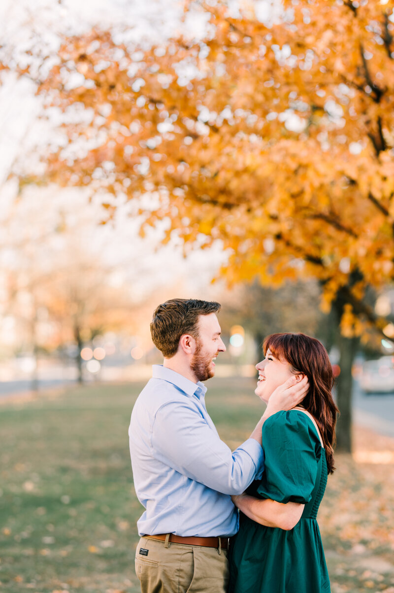 Couple engaged in Fall leaves virginia