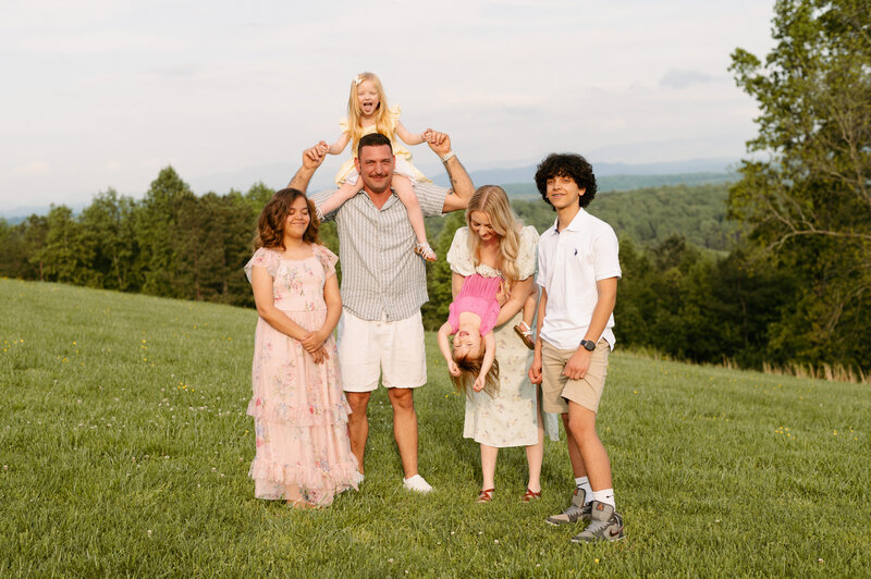 A mother and her children pose for a family photo.