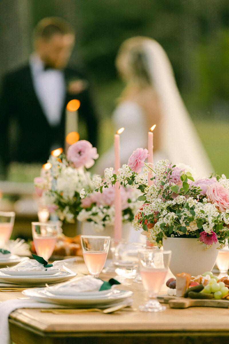 New York wedding photographer styled shoot featuring a tablescape with pink florals, antique decor, and garden party setup.