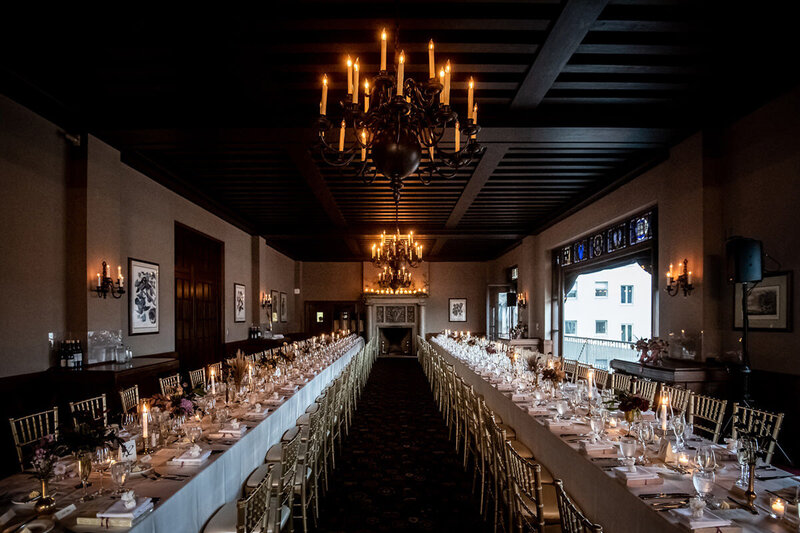 University Club San Francisco reception with long tables and dramatic chandeliers - wedding photographer