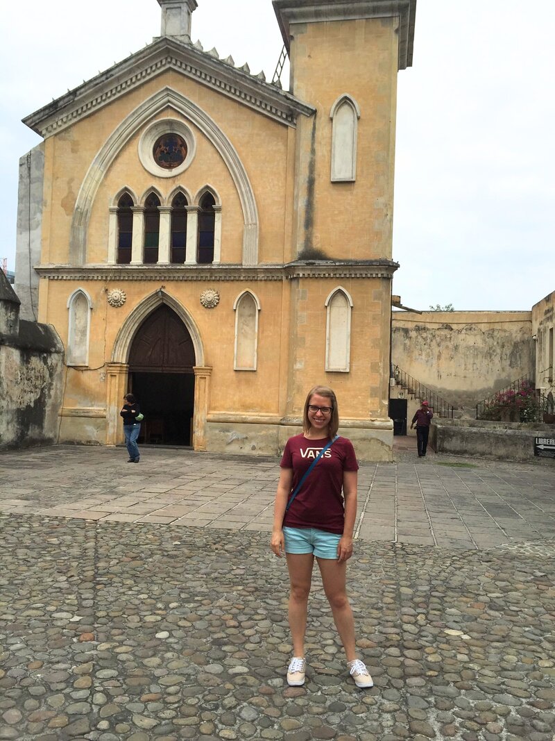 American accent coach Stephanie Pampel poses in front of an old church in Cuernavaca, Mexico.